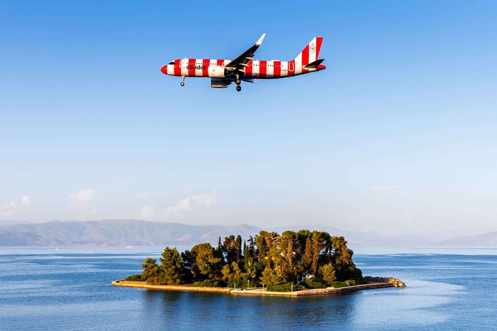 condor airplane flying over island